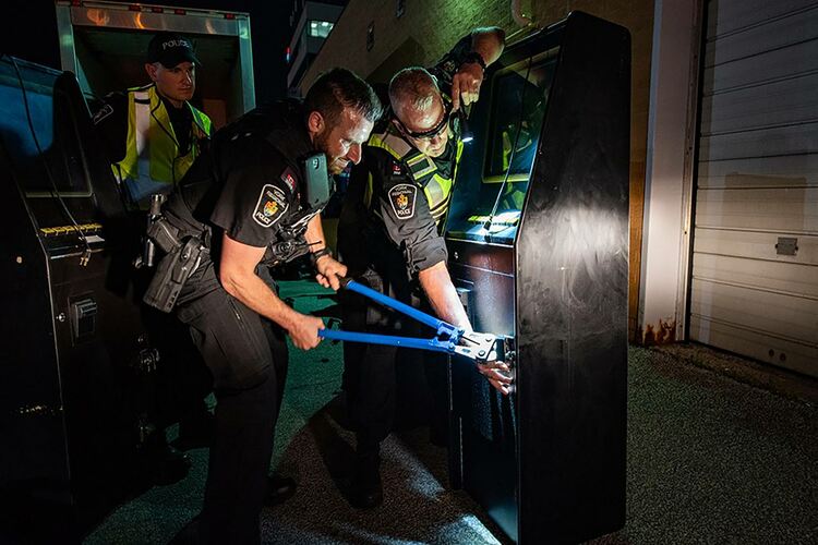 Police open a gaming machine